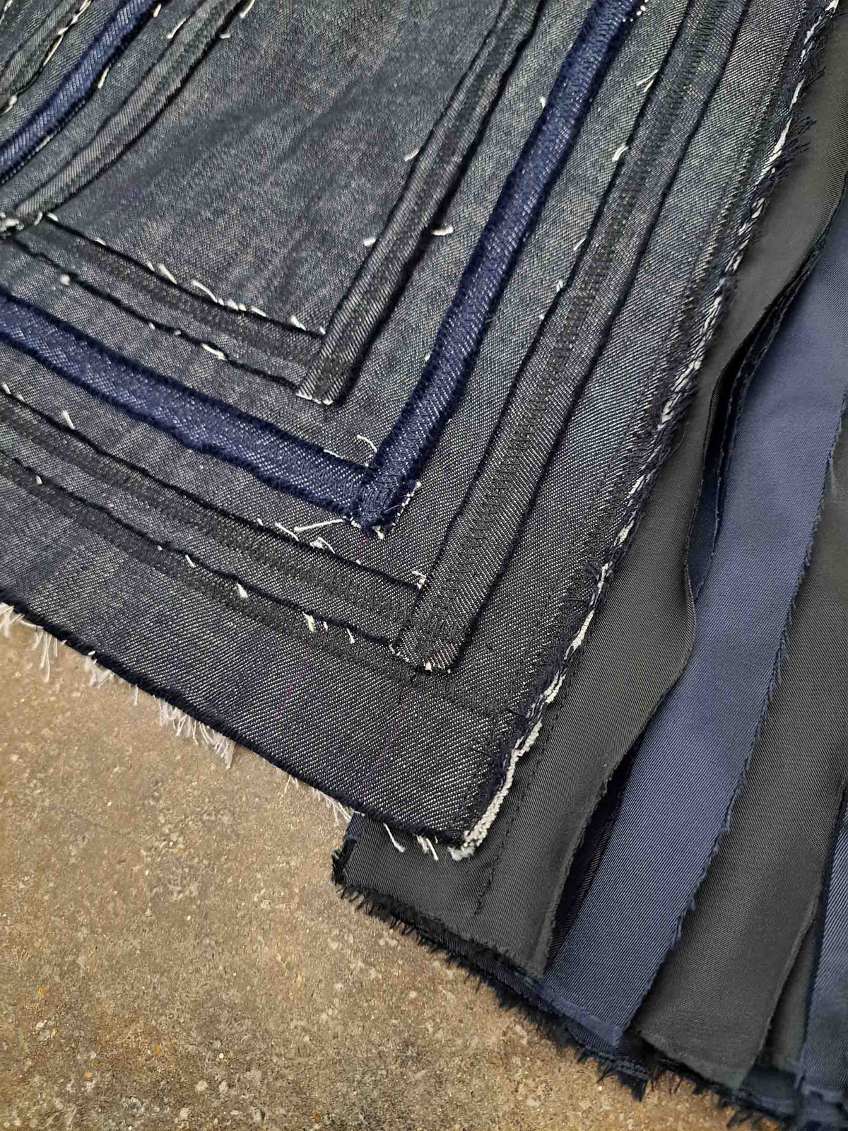 Layered grey fabric swatches